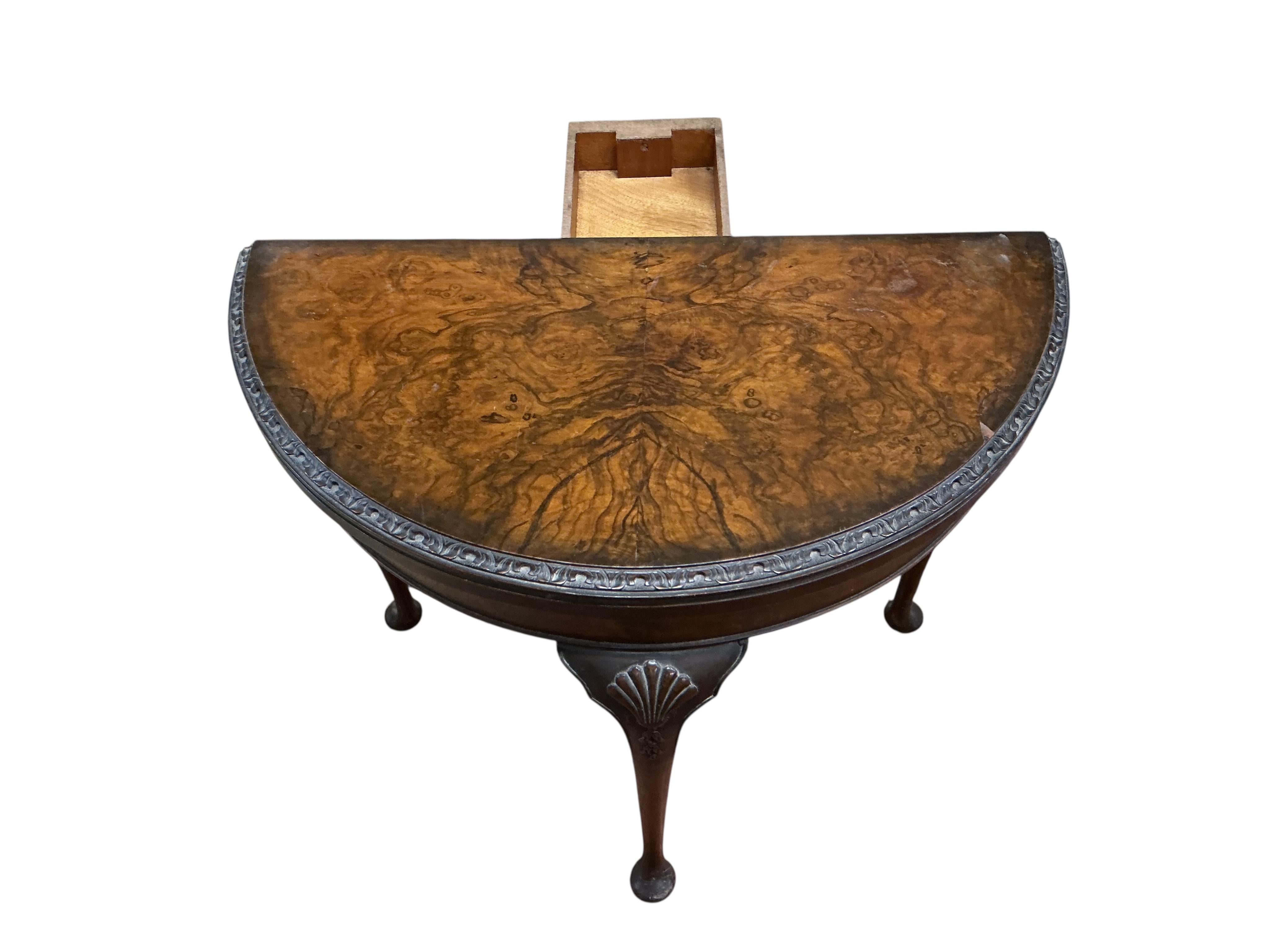 A Queen Anne Revival walnut demi lune folding card table, width 80cm, depth 42cm, height 74cm